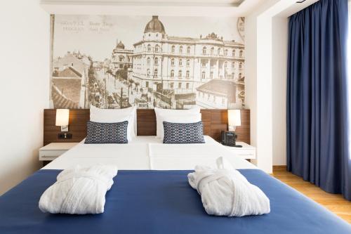 מיטה או מיטות בחדר ב-Abba Hotel