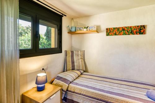 En eller flere senge i et værelse på Can Gori