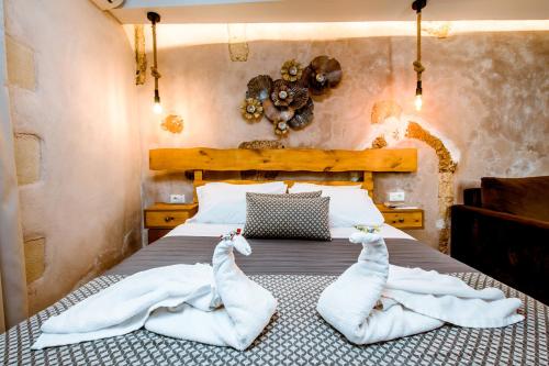 Ένα ή περισσότερα κρεβάτια σε δωμάτιο στο Bozzali Deluxe Hotel