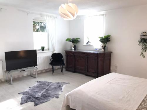 a bedroom with a bed and a flat screen tv at Jutta Deluxe Farmhouse in Zwettl Stadt