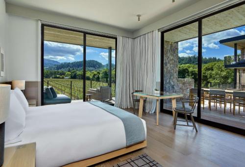 a bedroom with a bed and a large window at Alila Napa Valley in St. Helena