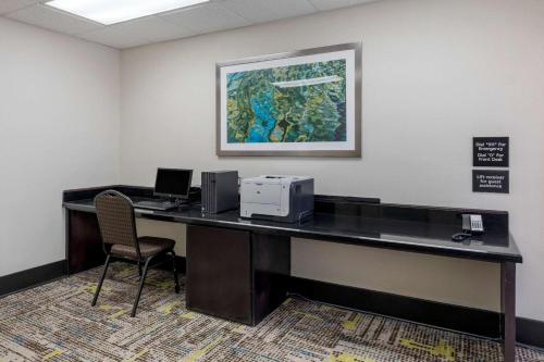an office with a desk with a printer and a computer at Comfort Inn Sherman in Sherman