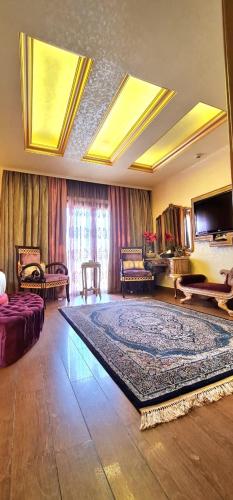 a living room with a large rug on the floor at Q Hotel in Beirut