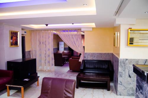 a living room with a couch and a table at Residency Hotel Area11 Garki Abuja in Abuja