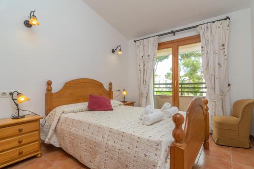 Posteľ alebo postele v izbe v ubytovaní Els Pins -Port d'Alcudia-