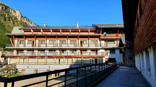 a building with a balcony in front of it at Village vacances de Val d'Isère in Val dʼIsère