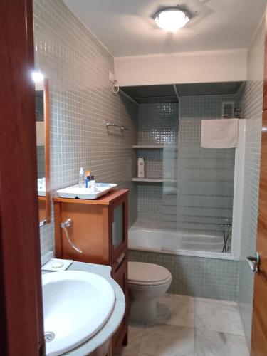 a bathroom with a sink and a toilet and a shower at Calle Ancla Isla Cristina in Isla Cristina