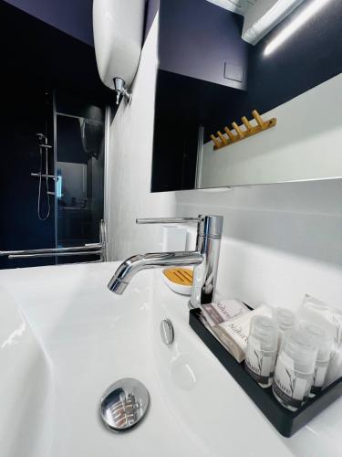 a bathroom counter with a sink and a sink at Dimora Casina dell'abbondanza in Gubbio