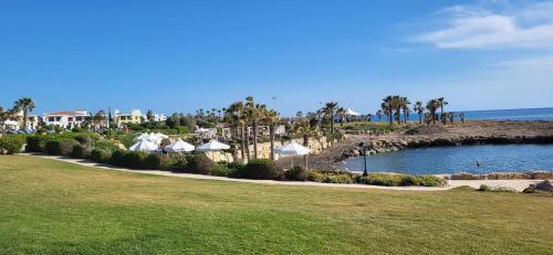 a view of a resort with a body of water at Georgia Apartments in Paphos City