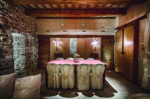 a dining room with a table and chairs in it at Villa la Rocca by Mmega in Ceretana