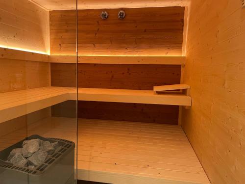 a sauna with wooden walls and wooden shelves at Chalet Tauplitz in Tauplitz