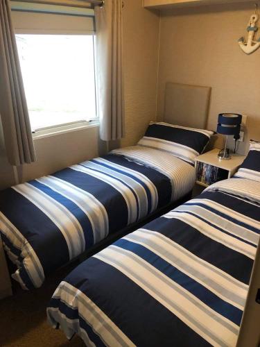 Säng eller sängar i ett rum på Covesea View
