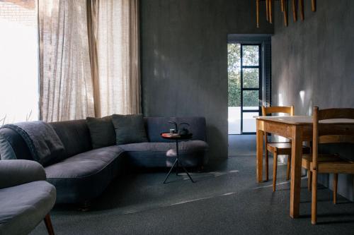 a living room with a couch and a table at InAweStays Holiday Homes in Cape Town
