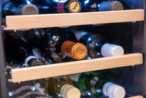 a bunch of wine bottles in a wine cellar at Mühlensteg Apartments by VISIMO - Elegant, Quiet, Central in St. Gallen