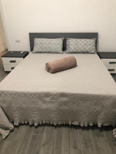 a large bed with a pillow on top of it at SweetHome in Lissone