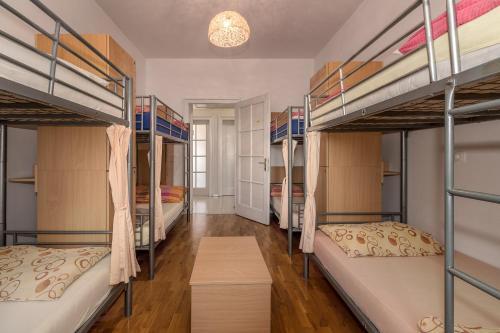 a room with four bunk beds in it at Hostel Split Backpackers in Split