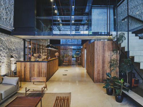 a living room with a couch and a table at AQ Tailored Suites in Buenos Aires