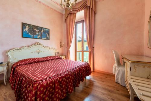 Giường trong phòng chung tại Gardasol Romantic 1 Vista Lago