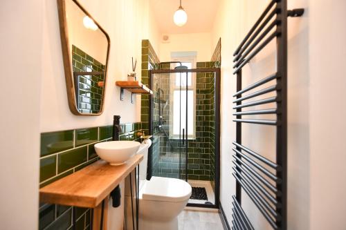 a bathroom with a toilet and a sink at Lallan Shores in Troon