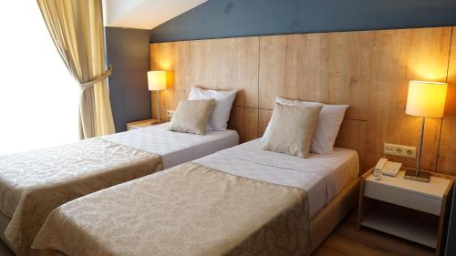 Postel nebo postele na pokoji v ubytování Hotel Felizya Kemer