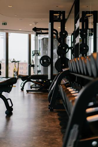 a gym with rows of benches in a room at Andaz Vienna Am Belvedere, By Hyatt in Vienna