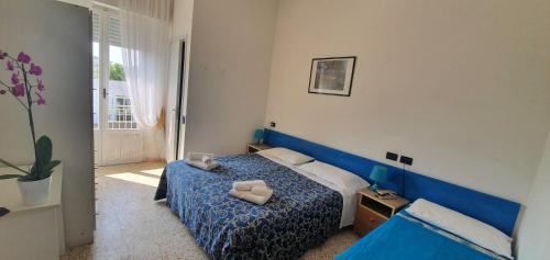 Postel nebo postele na pokoji v ubytování Arix Hotel