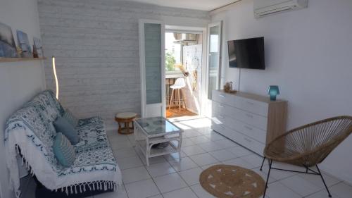 Coquet T2 climatisé, véranda vue mer, Le Caounil, St Pierre la Mer