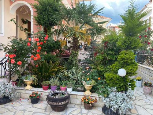 a garden filled with lots of plants and flowers at In The Castle - House in Ioannina