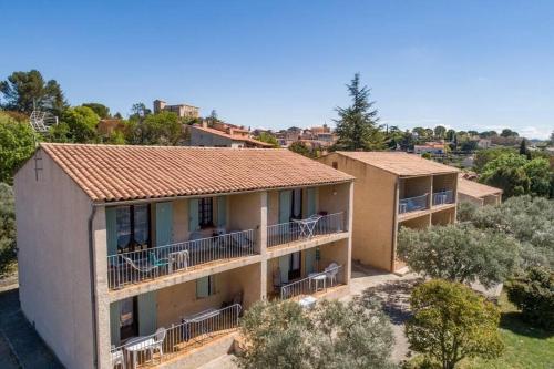 an aerial view of a house with balconies at Résidence Lou Cigaloun - ANA LOCATION in Gréoux-les-Bains