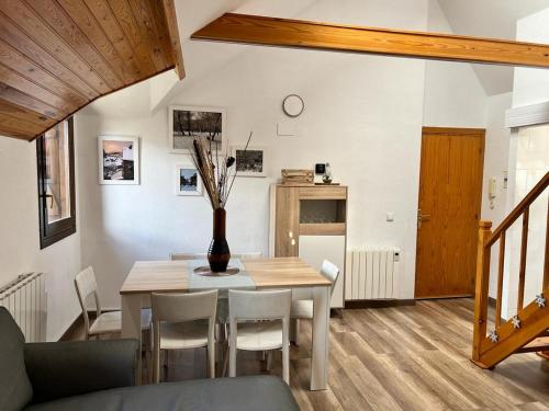 a dining room with a table and chairs at Casa Lita in Panticosa