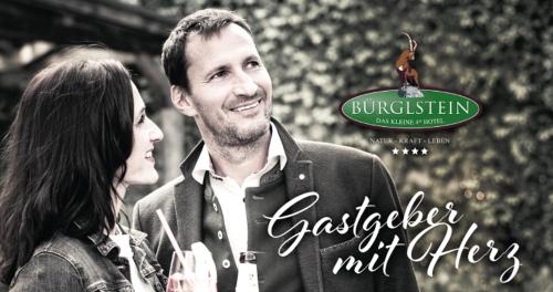 a man and a woman standing next to each other at Hotel Bürglstein in St. Wolfgang