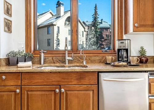 a kitchen counter with a sink and a window at 323 Beaver Creek Lodge in Avon