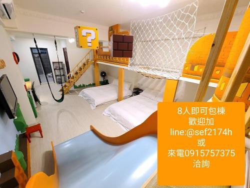 a room with two bunk beds and a net at 三木森sleep Inn 站前館 in Tainan