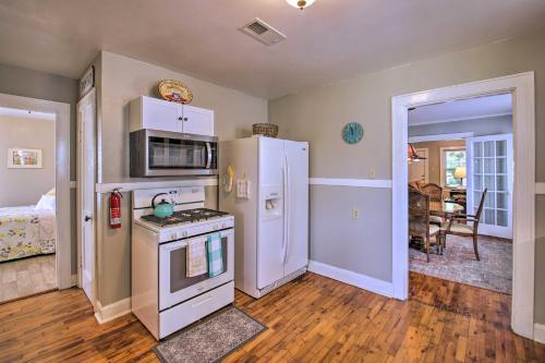 a kitchen with a stove and a refrigerator at Hot Springs Home - Walk to Oaklawn Casino! in Hot Springs