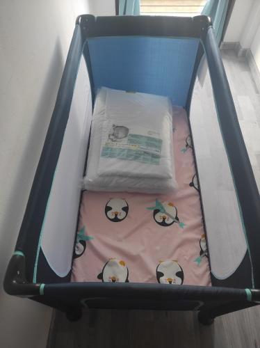a small crib with a hello kitty blanket at Haus Kraus in Bayerisch Eisenstein