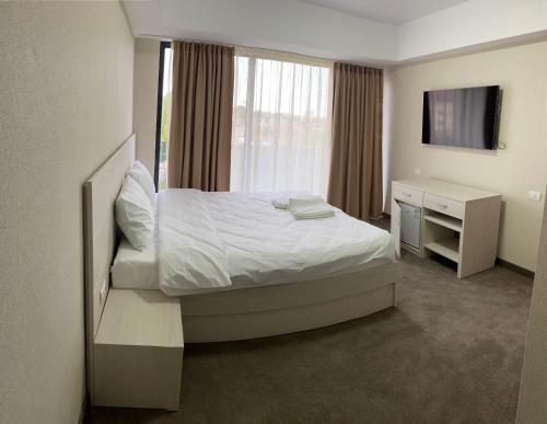 Кровать или кровати в номере Hotel Alis