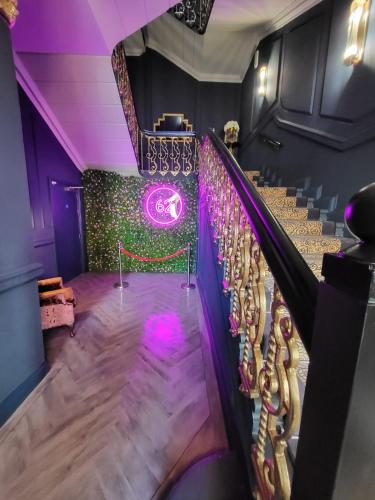 a set of stairs with purple lights in a room at 62 Castle Street Hotel in Liverpool