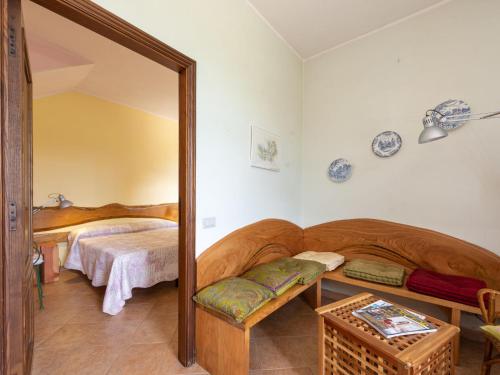 a bedroom with a mirror and a bed in a room at Holiday Home Podere Casidote by Interhome in Montieri