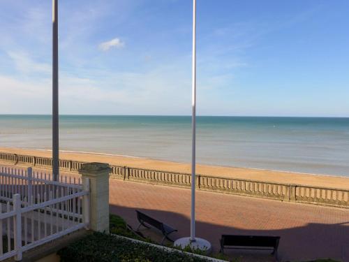 a view of the beach from the balcony of a condo at Apartment Cabourg Beach by Interhome in Cabourg