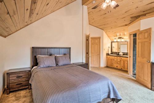 a bedroom with a bed and a wooden ceiling at Luxury Leadville Getaway with Hot Tub! in Leadville