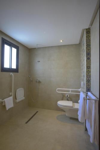 a bathroom with a toilet and a shower at MAIA HOTEL SUITES in Tunis