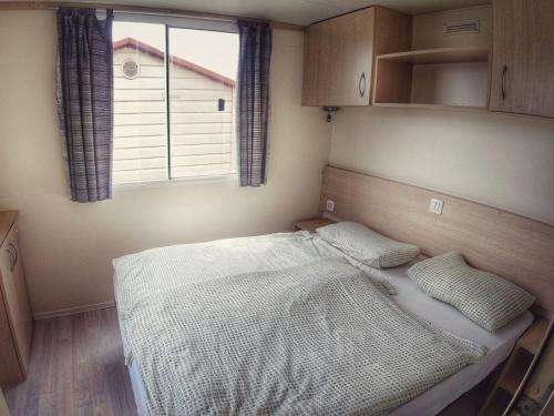 Katil atau katil-katil dalam bilik di Holiday Home Prima Plus by Interhome