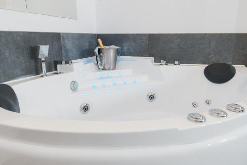 a white bath tub in a bathroom at Vinceia in Smederevo