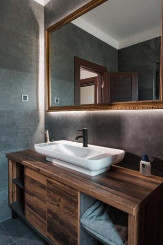 a bathroom with a sink and a mirror at Vinceia in Smederevo