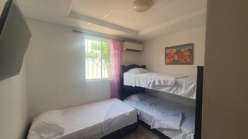 Lova arba lovos apgyvendinimo įstaigoje Casa de descanso Cartagena-Turbaco