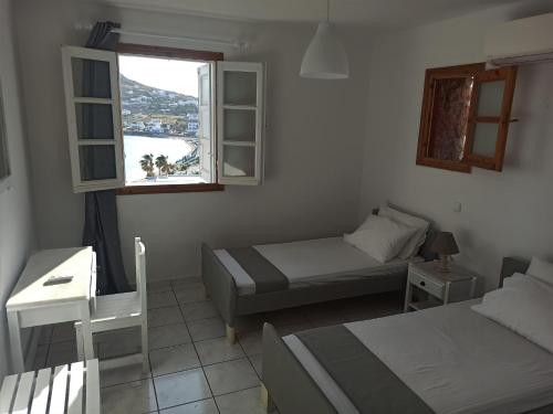 Posteľ alebo postele v izbe v ubytovaní Revel Mykonos 6