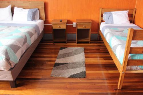Ein Bett oder Betten in einem Zimmer der Unterkunft Hostal Capricho de Carlitos