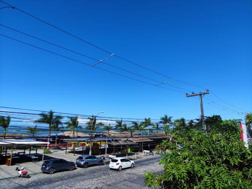 a group of cars parked in a parking lot at Hotel Porto Verde -JG in Porto Seguro