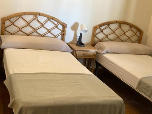 two beds sitting next to each other in a room at Posada la escuela - Bed&Breakfast in Cicera