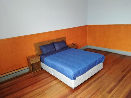 Ein Bett oder Betten in einem Zimmer der Unterkunft Hostal Capricho de Carlitos